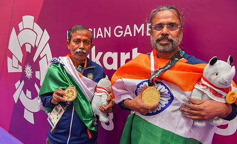 Gold medallists India's Pranab Bardhan and Shibhnath Sarkar pose with the Indian tricolour after winning in bridge competition at the 18th Asian Games in Jakarta. (Photo | PTI)
