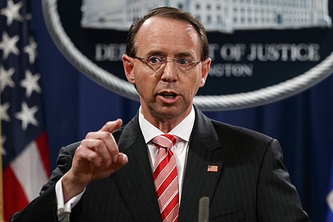 In this July 13, 2018, file photo, Deputy Attorney General Rod Rosenstein speaks during a news conference at the Department of Justice in Washington. Rosenstein is denying a report in The New York Times that he suggested last year that he secretly record