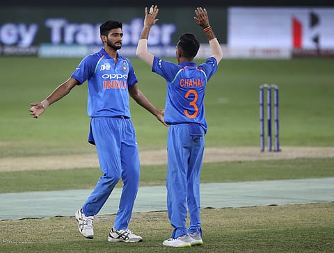 India's Khaleel Ahmed, left, celebrates with teammate India's Yuzvendra Chahal the dismissal of Hong Kong's Ehsan Khan during the Asia Cup match between India and Hong Kong in Dubai, United Arab Emirates, Tuesday, Sept. 18, 2018. | AP