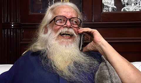 Former ISRO scientist Nambi Narayanan checking his phone on 14 September 2018 after the Supreme court verdict ordering compensation for him for being falsely accused in the ISRO spy case. (Photo | BP Deepu/ EPS)