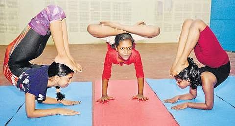 Three of the participants who will represent Kerala at the 8th edition of the Asian Yoga Sports Championship Vincent Pulickal