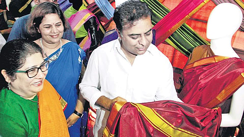Minister for Municipal Administration and Urban Development K T Rama Rao checks the quality of Bathukamma sarees at the Commissioner and Director of Municipal Administration Office at Masab Tank, in Hyderabad on Thursday | sathya keerthi