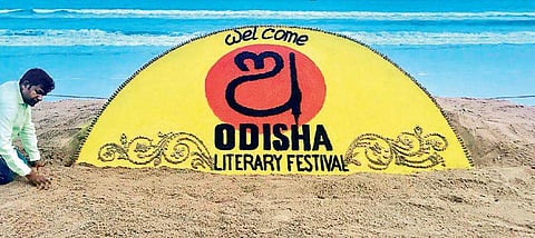 Renowned artist Sudarshan Patnaik with his sand sculpture on Odisha Literary Festival-2018 at Puri beach on the eve of the event on Friday | Express
