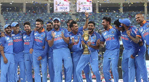 Indian players celebrate with the trophy after winning the Asia Cup final cricket match against Bangladesh, in Dubai, United Arab Emirates. (Photo| AP)