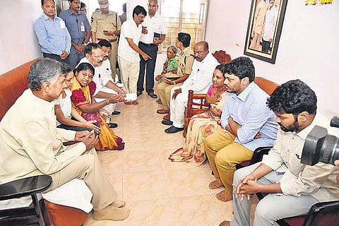 Chief minister N Chandrababu Naidu with family members of Araku TDP MLA Kideri Sarveswara Rao at the latter’s residence at Paderu at Visakhapatnam district on Friday; (below) Naidu consoles son of the MLA | Express