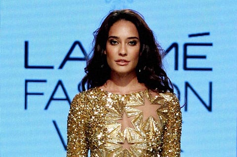 Bollywood actor Lisa Haydon displays the creation of fashion designer Monisha Jaising during the fourth day of the Lakme Fashion Week LFW summer/resort 2016 in Mumbai on Satuday. | PTI