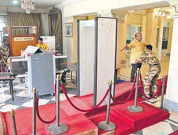 Security guards frisk visitors at Salar Jung Museum. (right) Official sleeping on the job at State Museum | R Satish Babu, Express
