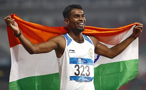 India's Dharun Ayyasamy celebrates after his second place finish in the men's 400m hurdles final during the athletics competition at the 18th Asian Games in Jakarta. (Photo | AP)