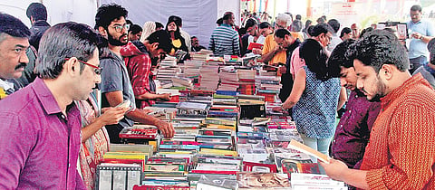 Visitors rummage through the plethora of books kept for sale on the concluding day of the Hyderabad Literary Festival 2019 in Hyderabad on Sunday | s senbagapandiyan