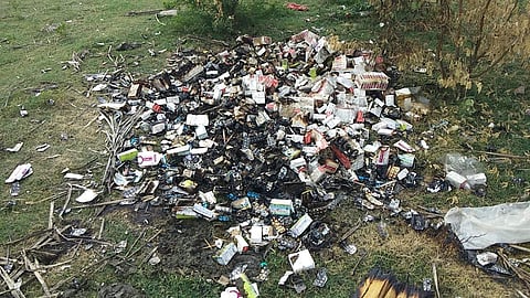 Medical wastes being dumped in the Tiruneermalai lake. ( Photo | Special Arrangement )
