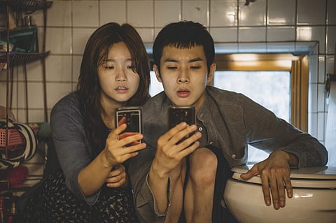 This image released by Neon shows So-dam Park, left, and Woo-sik Choi in a scene from 'Parasite.' (Photo | AP)