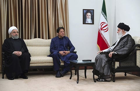Iranian Supreme Leader Ayatollah Ali Khamenei (R) meets Pakistani Prime Minister Imran Khan (C) with Iranian President Hassan Rouhani in Tehran (Office of the Iranian Supreme Leader via AP)