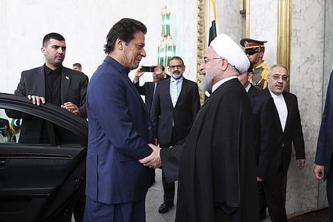 Iranian Presidency, President Hassan Rouhani, right, welcomes Pakistani Prime Minister Imran Khan at the Saadabad Palace in Tehran (Photo| AP)