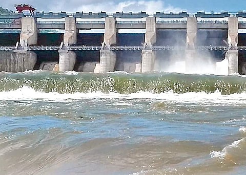 Srisailam dam officials lift four crest gates and release water downstream Nagarjuna Sagar on Sunday I Express