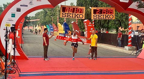 Andamlak Belihu at the finish line of the Delhi Half Marathon