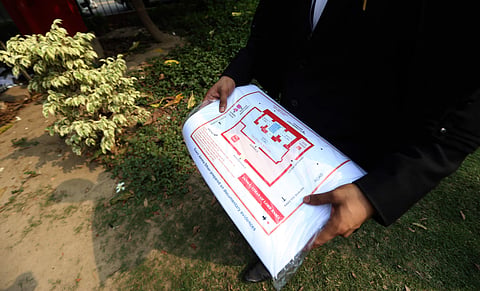 A lawyer holds a map of the alleged original site of Ram Janmabhoomi that was torn during the hearing of the Ayodhya land dispute case in the Supreme Court. (Photo | Arun Kumar, EPS)