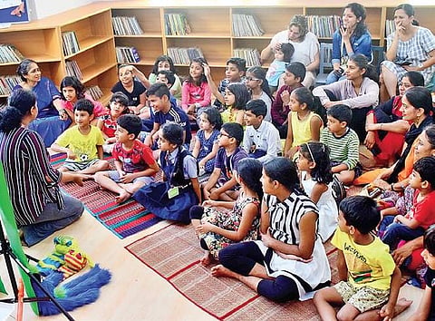 Children enjoy a storytelling session held at the kids’ section in City Central Library, Indiranagar | Pandarinath B