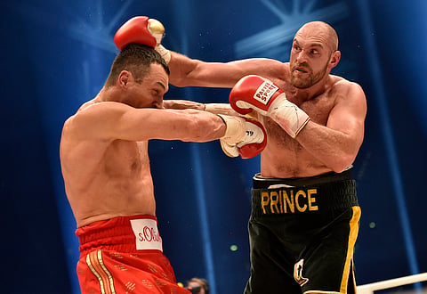 British heavyweight boxer Tyson Fury (R) | AP