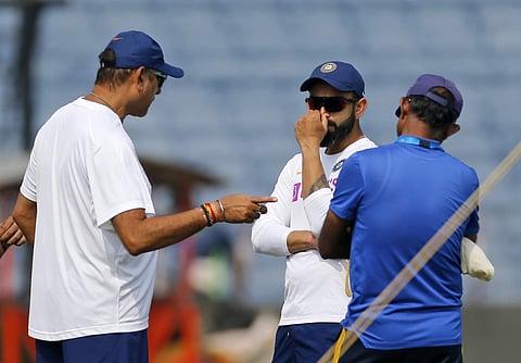 Indian cricket team captain Virat Kohli listens to coach Ravi Shastri. (Photo | AP)