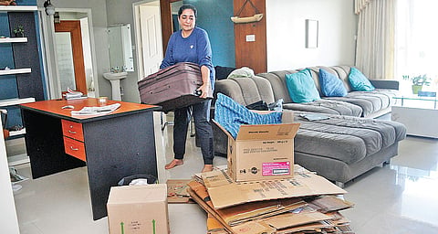 Apartment owner Saleena Mustafa packing her clothes and other items into boxes and suitcases at the H20 Holy Faith Apartments in Maradu, which is slated for demolition A Sanesh