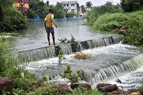 The Araabath lake, Thirumulvoyal, overflows after the recent rains in Chennai - Express / P Jawahar