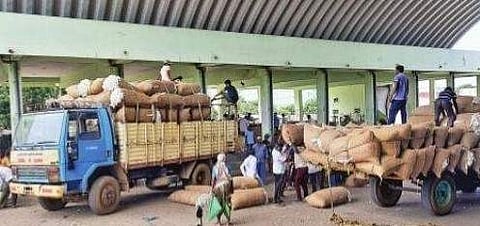 Farmers arrive at the Enumamula agriculture market in Warangal with their cotton crop on Tuesday