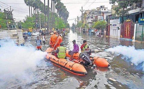 Patna Municipal Corporation (PMC) workers fumigate a flood-affected area as a precautionary measure against water-borne diseases on Thursday | pti