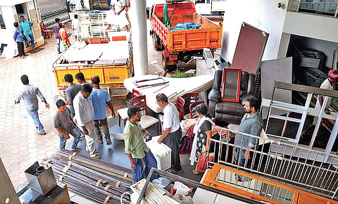 Residents of Holy Faith H2O remove household items on Saturday as Maradu municipality has allowed the flat owners to shift their belongings till October 11.| (A Sanesh | EPS)