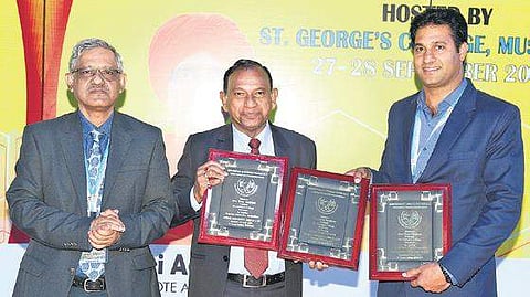 Gerry Arathoon (middle), chief executive officer &secretary, CISCE, awarded ‘Best Principal’ certificate to Brother Tony Verghese (Right), principal, St George’s College. (Photo | EPS)
