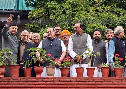 National Conference President Farooq Abdullah waves towards media persons during a meeting with party leaders at his residence in Gupkar in Srinagar Sunday Oct. 6 2019. | (Photo | PTI)