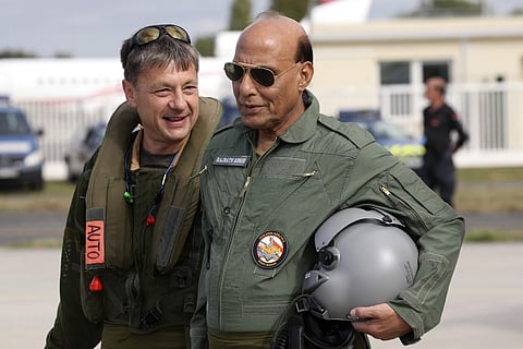 Indian Defense Minister Rajnath Singh talks with Dassault Aviation chief pilot Philippe Duchateau before a test flight in a Rafale jet fighter at the Dassault Aviation plant in Merignac, near Bordeaux, southwestern France, Tuesday, Oct. 8, 2019. | (Photo