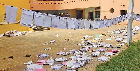 Books are put out to dry at Shree Sharadamba Vidyaniketan School | express