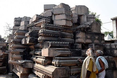 Visitors look at stone slabs carved-out for the construction of Ram Temple at Shri Ram Janmbhoomi Karyashala workshop in Karsewakpuram Ayodhya Monday Nov. 11 2019. (Photo | PTI)