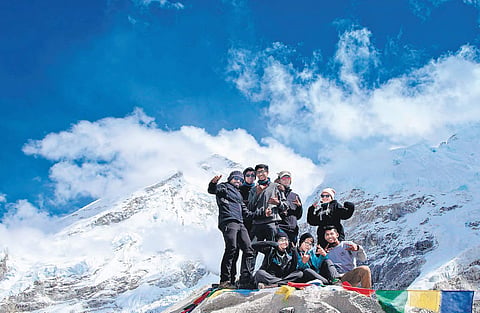 The students rejoice after reaching the Everest Base Camp, which is located 5,365 metres above sea level