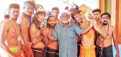 Siddique, staff of Vavar Mosque at Erumeli, with devotees on the premises of the mosque on Saturday | A Sanesh