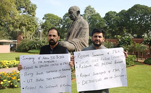 PDP MP Nazir Ahmad Laway and Mir Fayaz protesting outside the Parliament House in New Delhi on Monday. | (Photo | Shekhar Yadav/EPS)