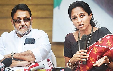 Nationalist Congress Party spokesperson Nawab Malik with Supriya Sule at a press conference. (File Photo | PTI)