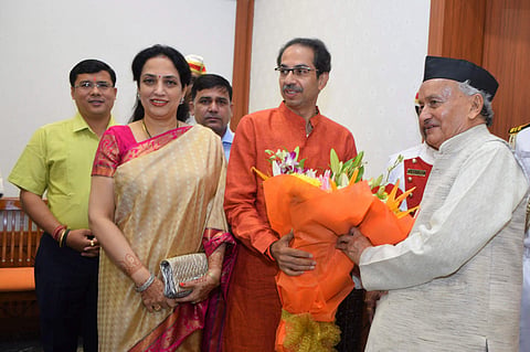 Maharashtra Governor Bhagat Singh Koshyari receives a bouquet from state Chief Minister-designate Uddhav Thackeray and his wife Rashmi Thackeray at Raj Bhavan in Mumbai Wednesday Nov. 27 2019. (Photo | PTI)