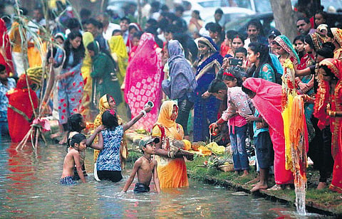 Devotees perform prayers during Chhath Puja in New Delhi. (Photo | Arun Kumar, EPS)