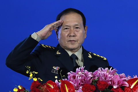 Chinese Defense Minister Wei Fenghe salutes after delivering his opening speech for the Xiangshan Forum. (Photo| AP)