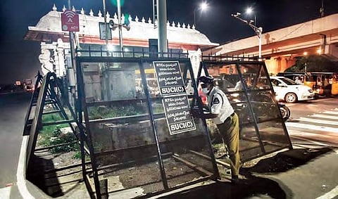 Barricades being erected on Friday on the eve of the ‘Chalo Tank Bund’ protest in Hyderabad by the TSRTC employees. (Photo | EPS, Vinay Madapu)