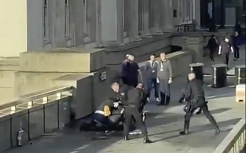 Usman Khan surrounded by armed police after the attack on London Bridge. (Photo | AP)