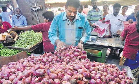 Slew of customer purchasing 4kg onions at Rs 100 from Bakeeran’s shop in Cuddalore on Tuesday | express