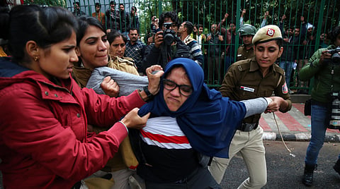 Delhi police officials detain Jamia students during their protest against the passing of Citizenship Amendment Bill, at Jama in New Delhi on Friday, Dec. 13, 2019.(Photo | Parveen Negi, EPS)