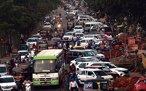 Overflowing vehicular traffic, on-street parking in Janpath - the main road of Bhubaneswar’s central business district. (Photo | EPS)