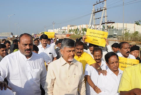 TDP chief Chandrababu Naidu and other party members 'walk reverse' to protest against the state's 'reverse tendering process' in Velagapudi on Monday| Prasant Madugula