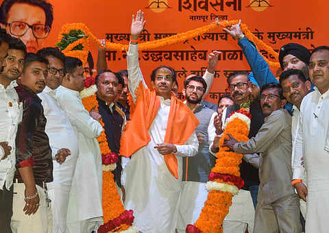 Maharashtra Chief Minister and Shiv Sena chief Uddhav Thackeray being garlanded by party wokers at a party meeting in Nagpur Monday Dec. 16 2019. (Photo | PTI)