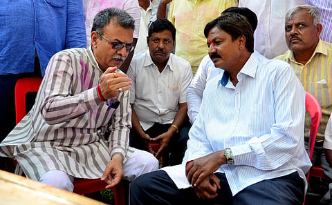 Mahesh Kumathalli and Ramesh Jarkiholi outside the counting venue in Belagavi. (Photo | Ashishkrishna H P)
