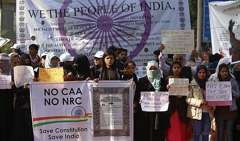 Protestors including students and local residents during a demonstration against the Citizenship Amendment Act CAA outside Jamia Millia Islamia University in New Delhi on Sunday. (Photo | EPS/Arun Kumar)