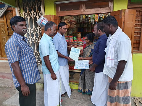 Independent Candidate C Pugazhenthi give affidavits duly signed with all the promises to the public at Peruvalappur in Tiruchy. (Photo | EPS)